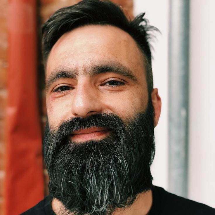 Kaveri Mehta, Lead Design Curator at Arbor Stone Hub, reviewing corporate floral arrangements